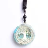 Pendentif Orgonite Arbre de Vie Turquoise Pendentif orgonite arbre de vie turquoise sur fond blanc